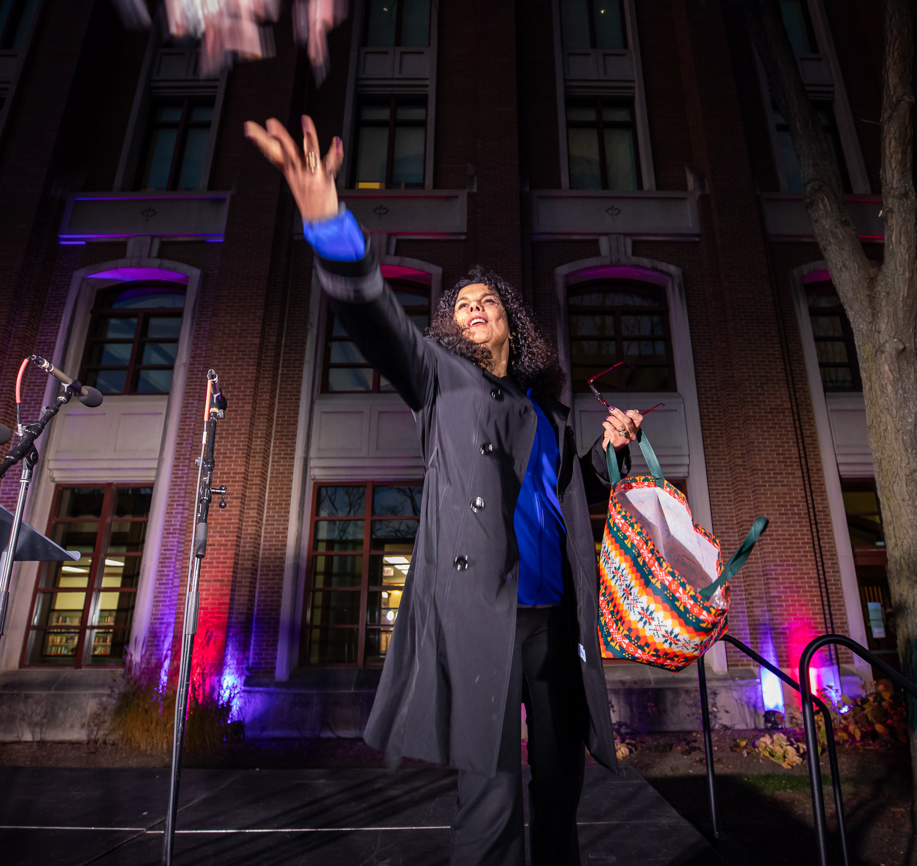Provost Salma Ghanem tossed candy canes to students after her speech. (Photo by Jeff Carrion / DePaul University) 